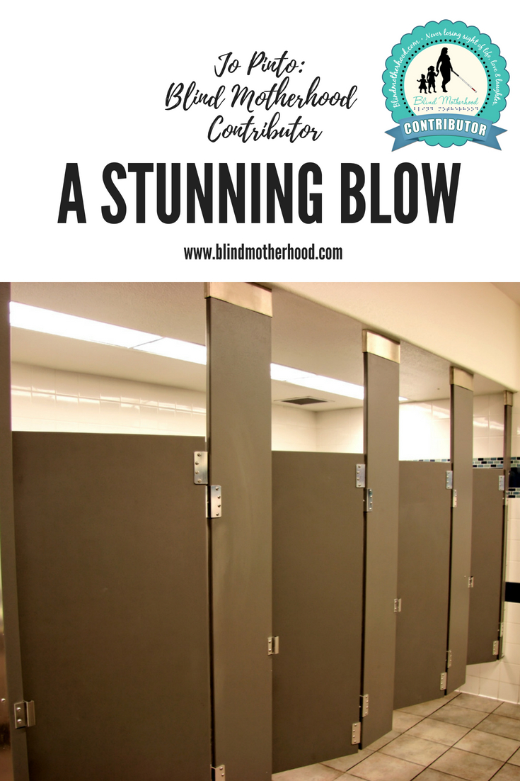 A photo of a line of bathroom stalls in a public restroom.