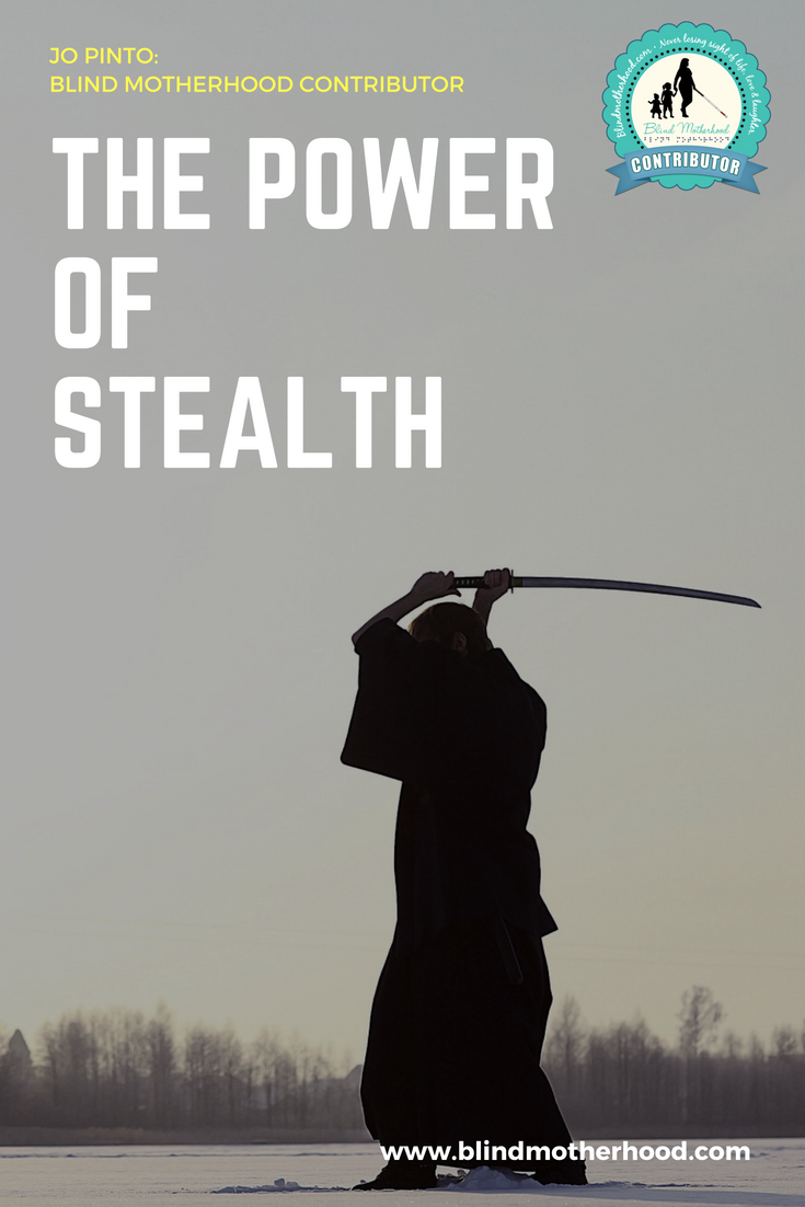 A silhouette of a ninja raising a sword on a black and gray background.