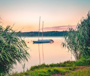 A sailboat drifts in the water